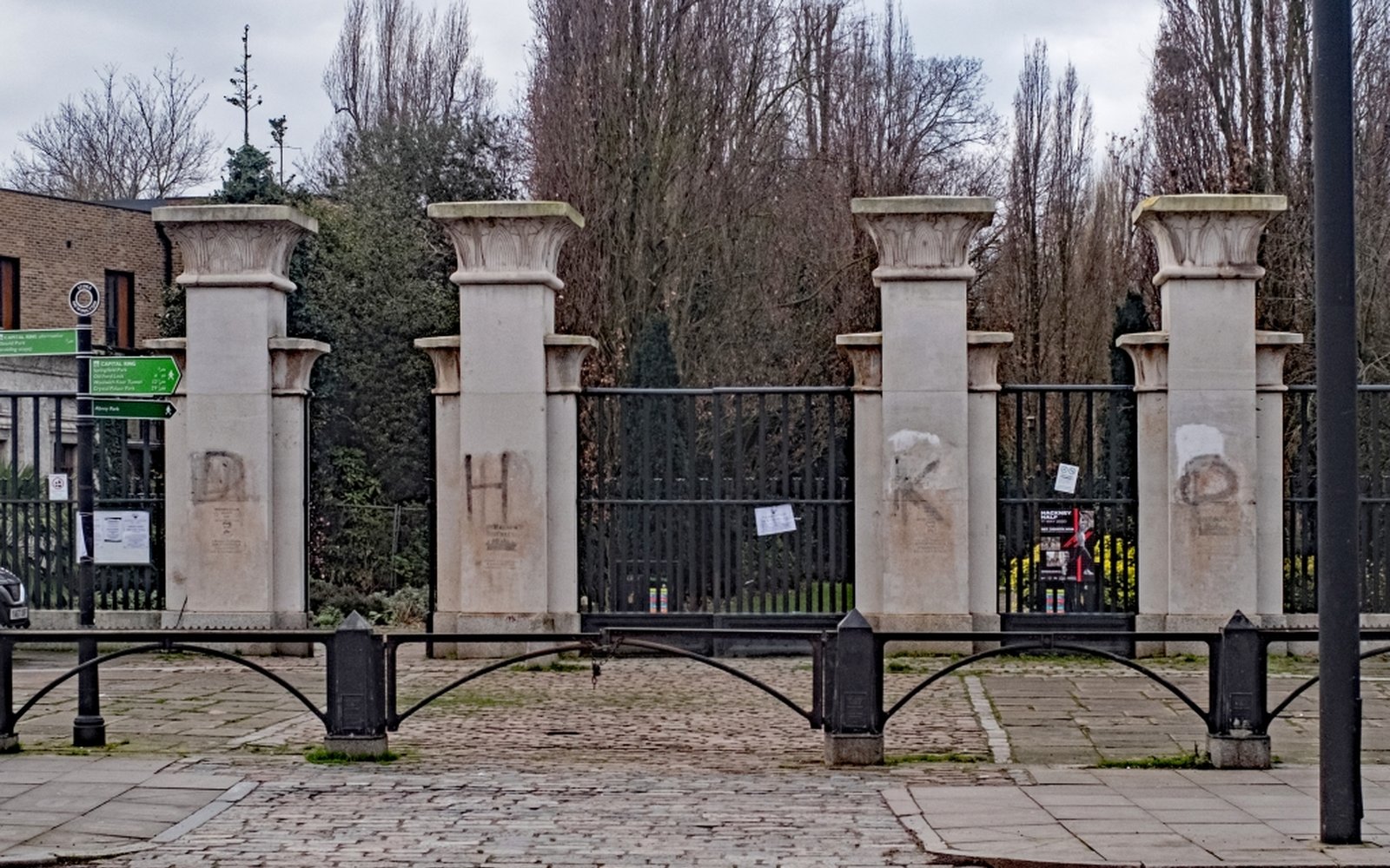 Egyptian Revival entrance gates at Abney Park, Stoke Newington — meet here before a dog walk and a Church Street pint.